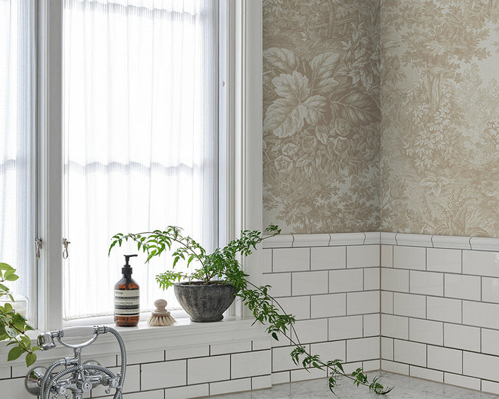 Sandberg Forest Toile Wallpaper in Sandstone in a bathroom