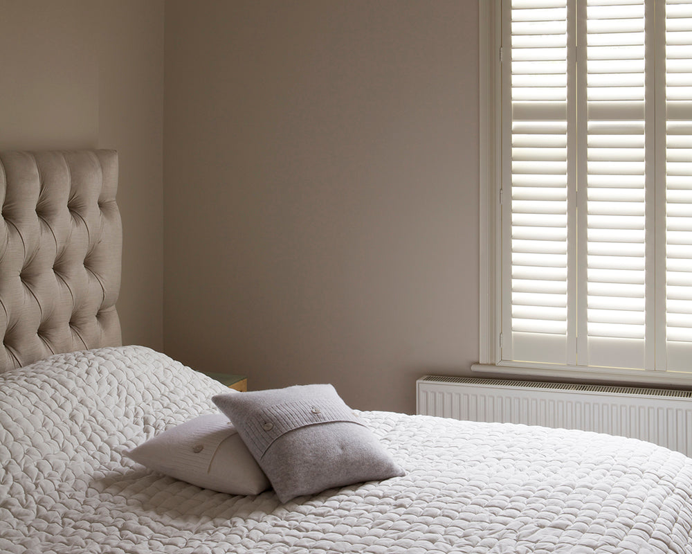 Skimming Stone 241 paint by Farrow & Ball in a classic bedroom