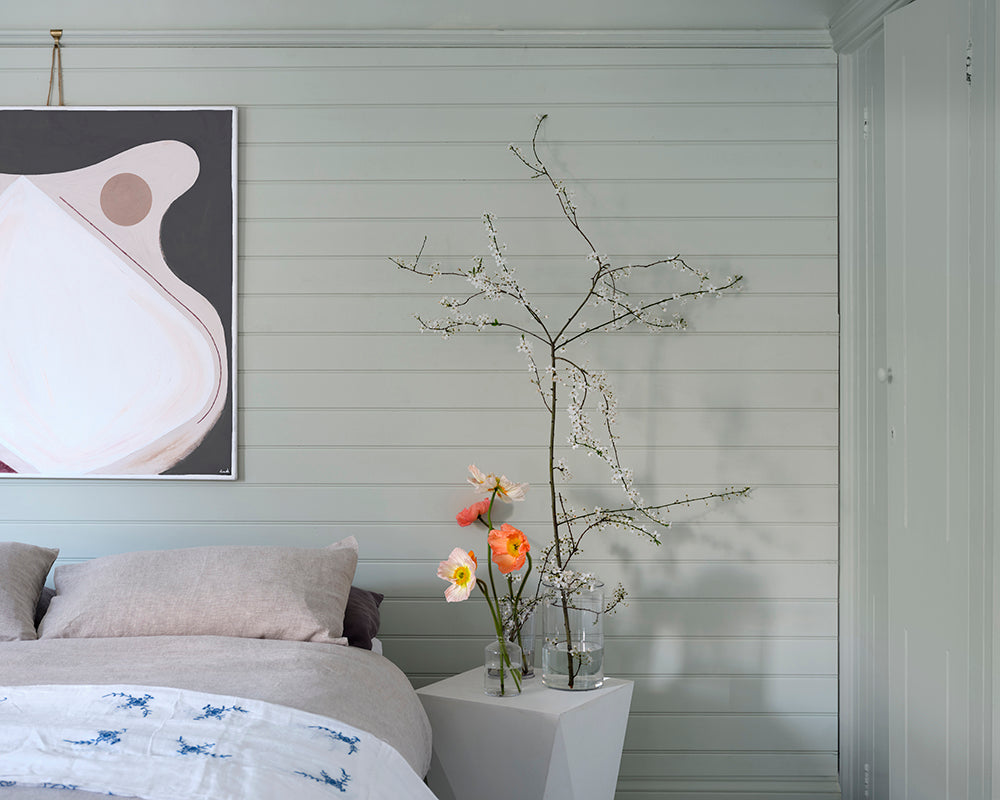 Eddy 301 paint by Farrow & Ball on a cladded bedroom wall
