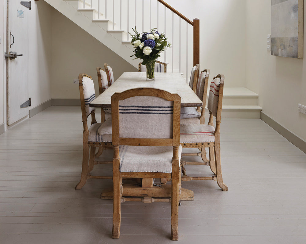 Hardwick White 5 paint by Farrow & Ball on a dining room wooden floor