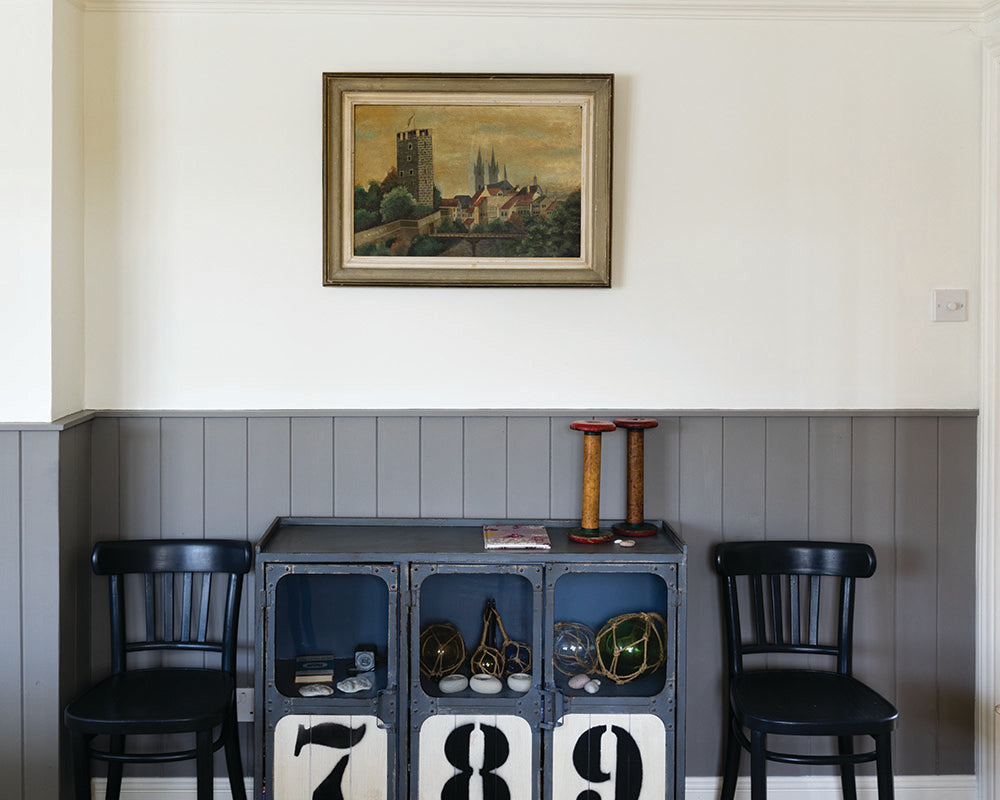 Mole's Breath 276 paint by Farrow & Ball on cladding in a living room