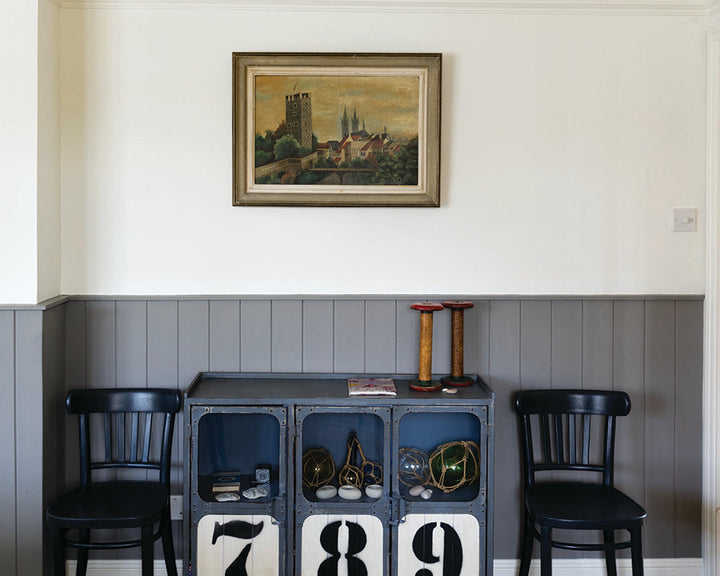 Mole's Breath 276 paint by Farrow & Ball on cladding in a living room