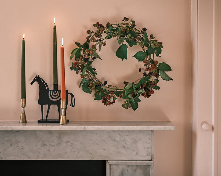 Pink Ground 202 paint by Farrow & Ball on the walls with a fireplace