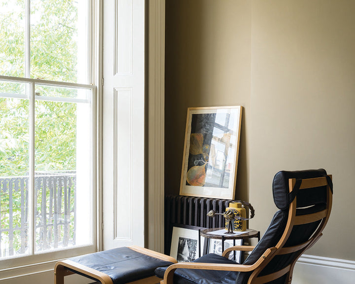 Buff 20 paint by Farrow & Ball in a retro living space