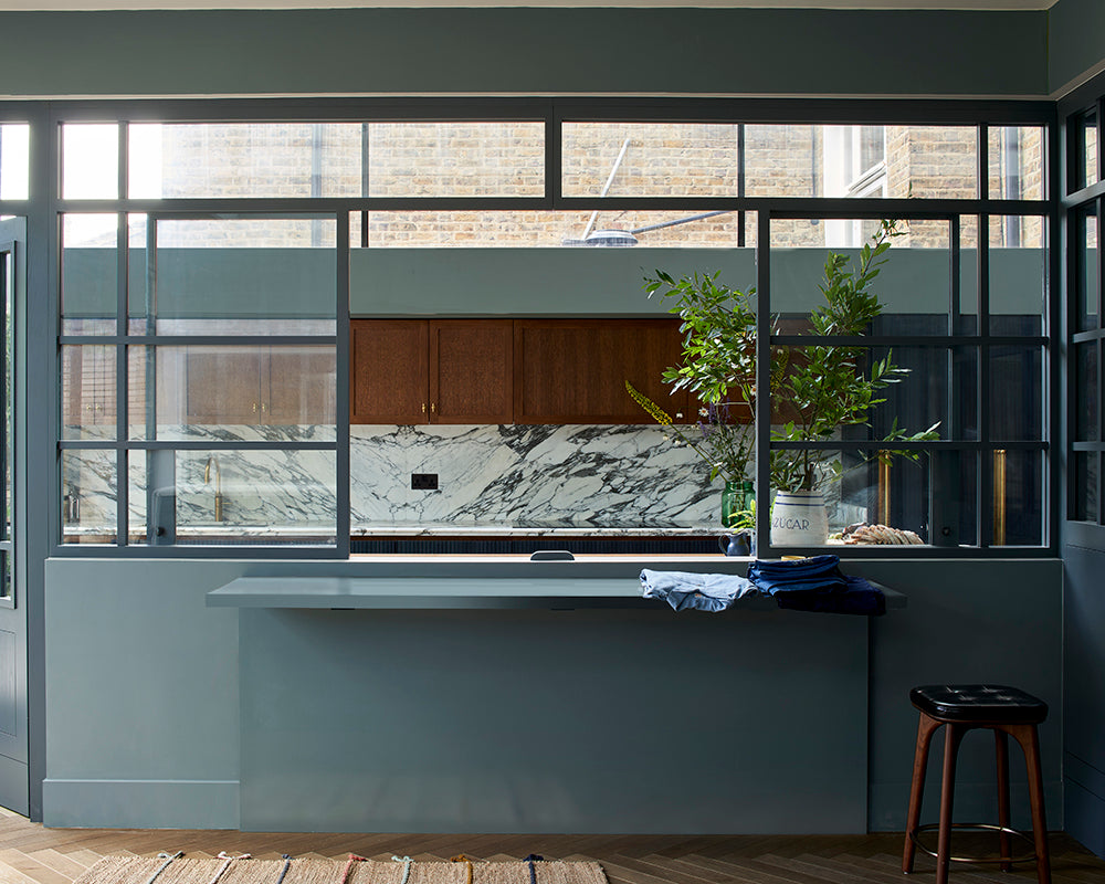 De Nimes 299 paint by Farrow & Ball used in a kitchen with strong architectural features