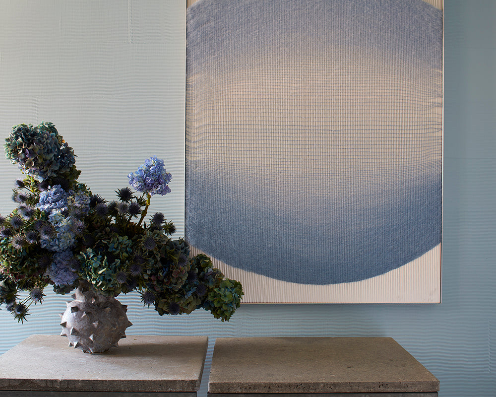 Hazy CC6 paint by Farrow & Ball on a wall with modern artwork