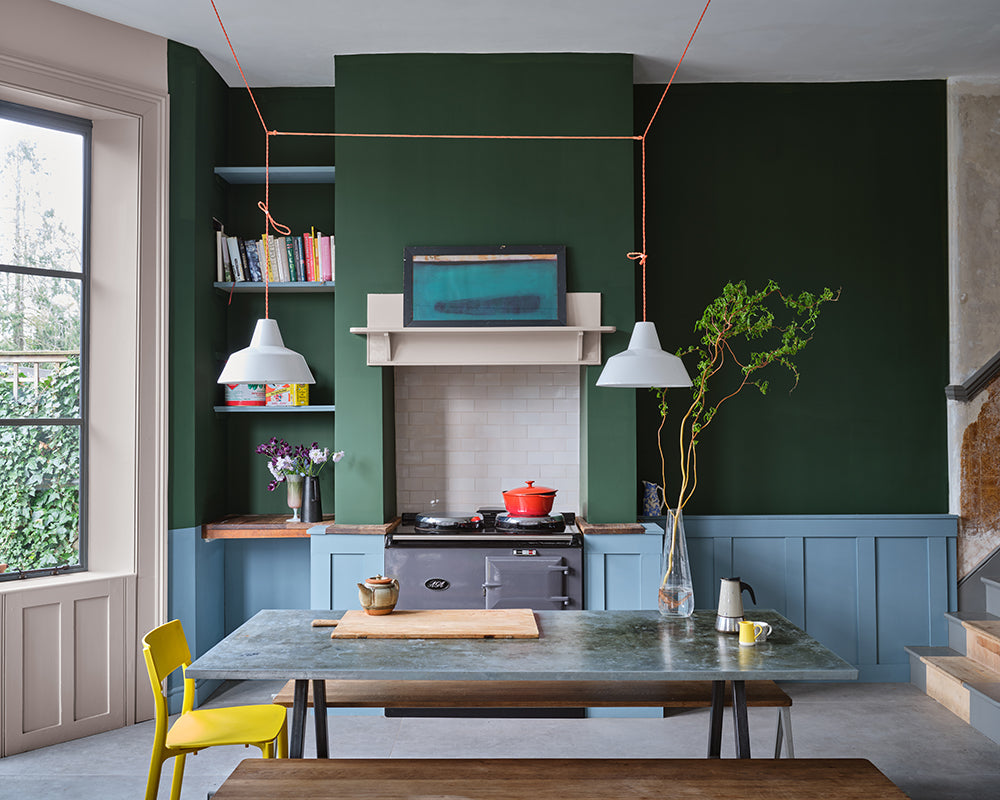 Selvedge 306 paint by Farrow & Ball on panelling in an open plan kitchen
