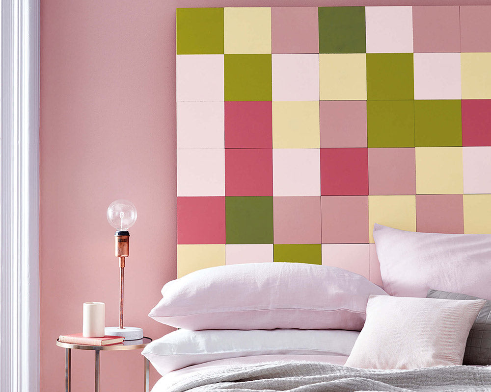 Little Greene Hellebore 275 Paint behind a colourful headboard