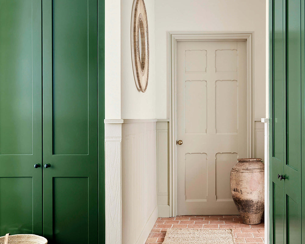 Little Greene Dark Brunswick Green 88 Paint on woodwork in a hallway