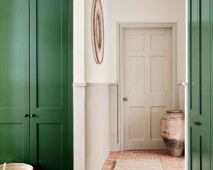 Little Greene Dark Brunswick Green 88 Paint on woodwork in a hallway