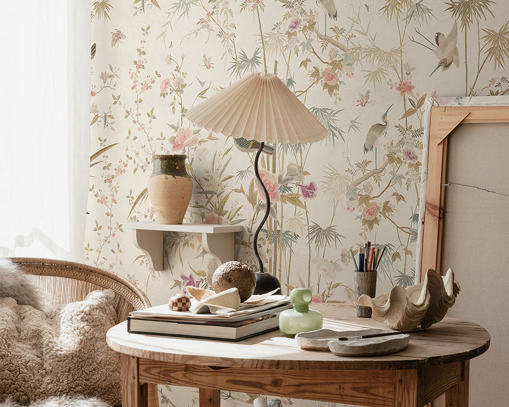 Sandberg Chinoiserie Garden Wallpaper in Eggshell on a desk set up