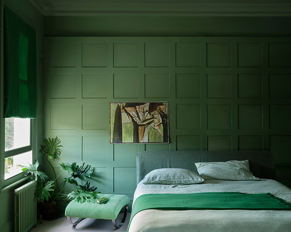 Calke Green 34 paint by Farrow & Ball on panelling of a bedroom
