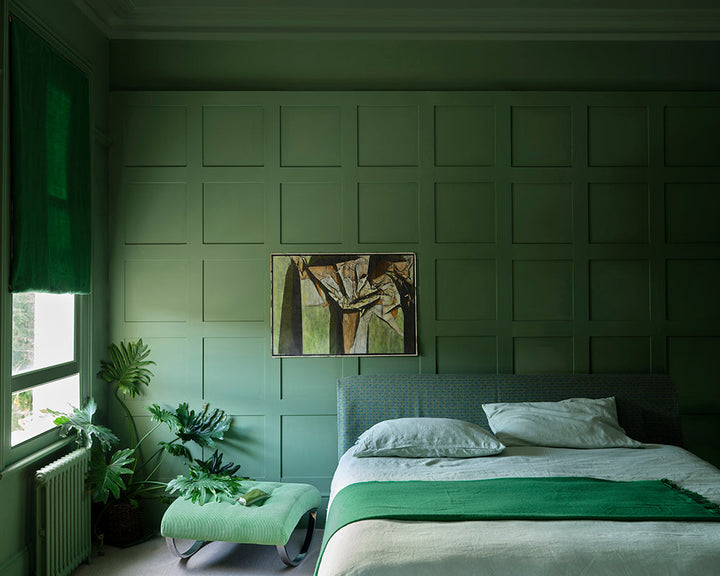 Calke Green 34 paint by Farrow & Ball on panelling of a bedroom