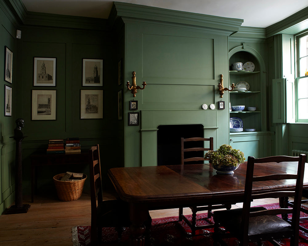 Calke Green 34 paint by Farrow & Ball on the walls and woodwork of a dining room
