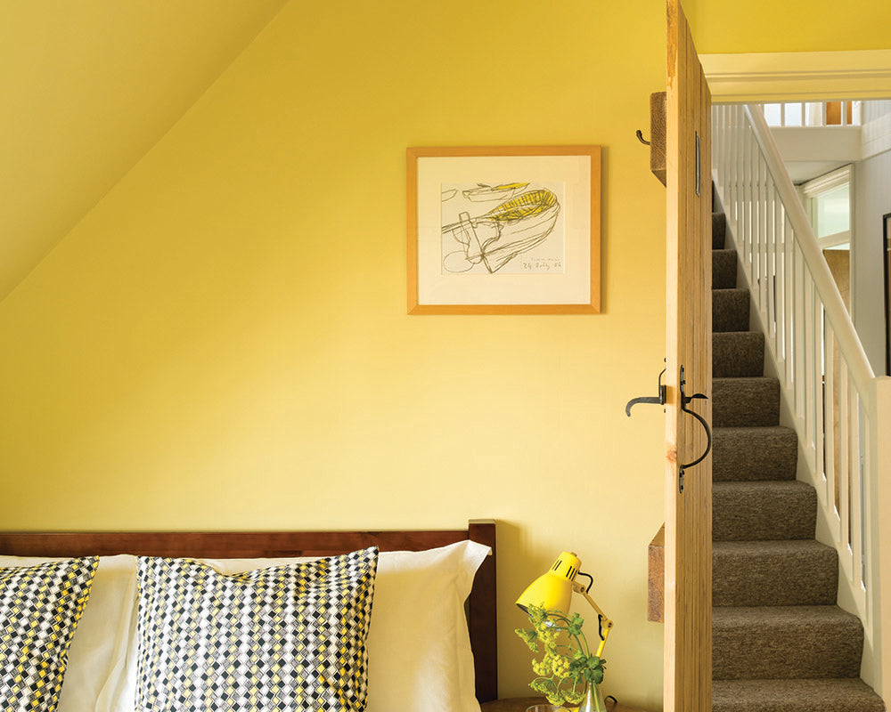 Ciara Yellow 73 paint by Farrow & Ball used in a bedroom