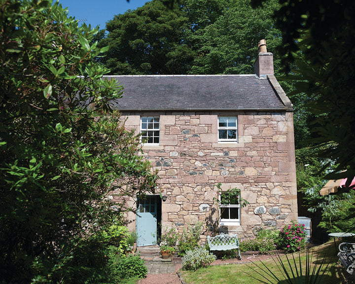 Green Blue 84 paint by Farrow & Ball used on the exterior woodwork of a country farmhouse