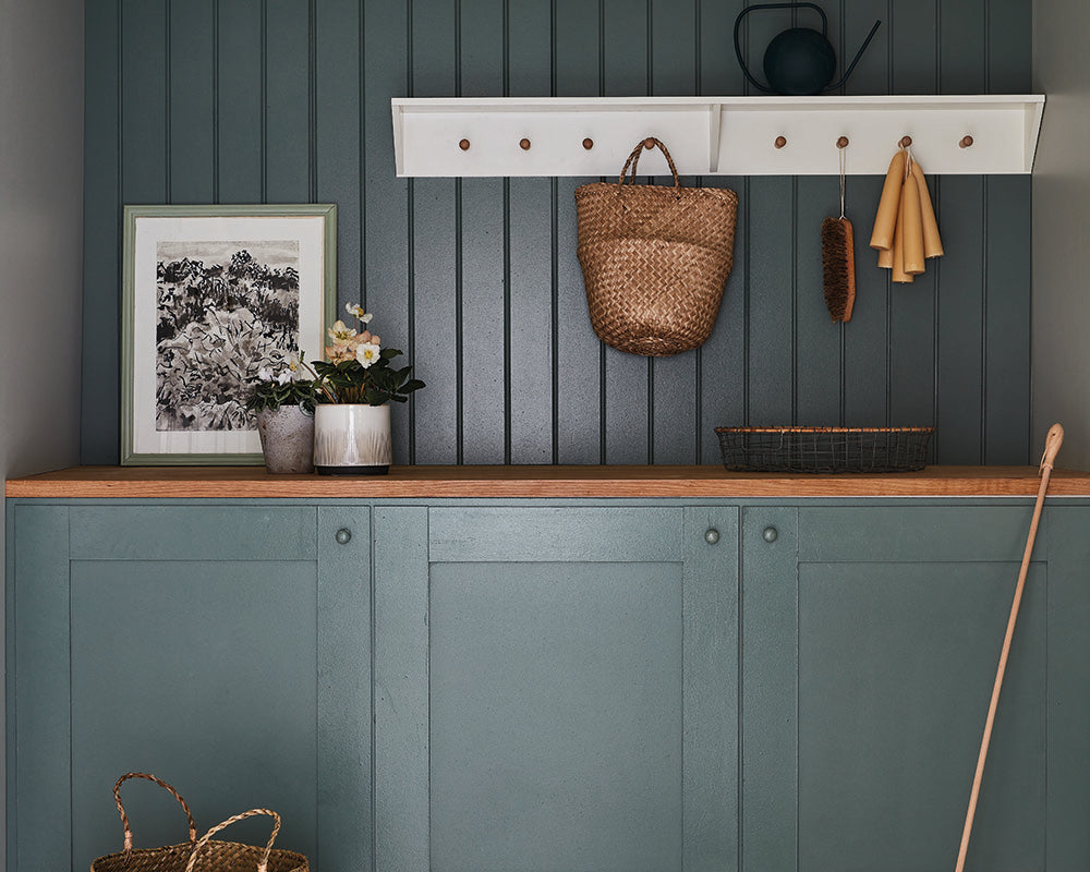 Green Smoke 47 paint by Farrow & Ball on cladding in a utility space