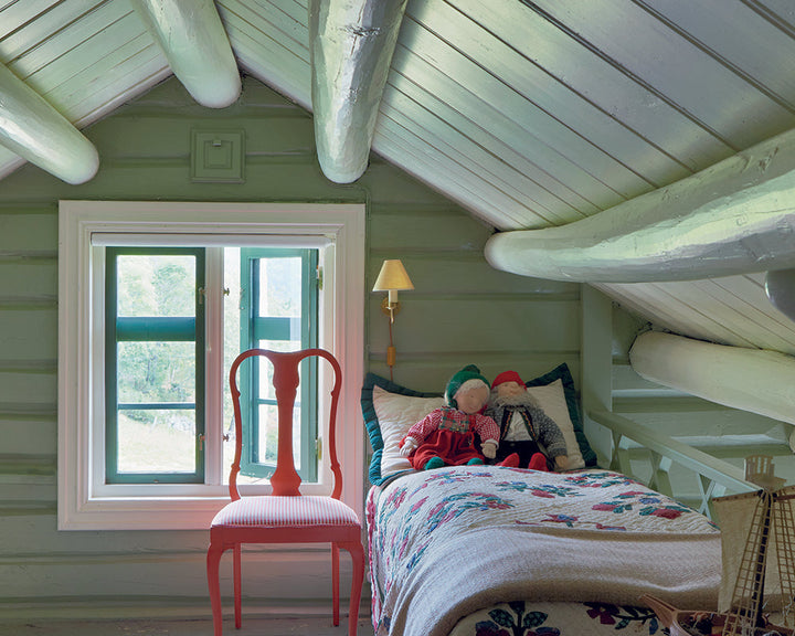 Lichen 19 paint by Farrow & Ball on cladding in a cottage bedroom