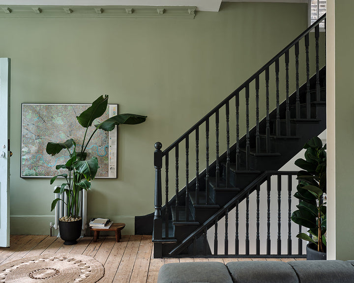 Studio Green 93 paint by Farrow & Ball on the banister and spindles in a hallway