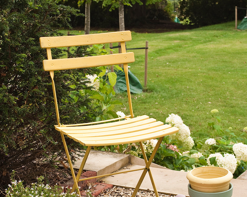 Yellow Ground 218 paint by Farrow & Ball on a garden chair