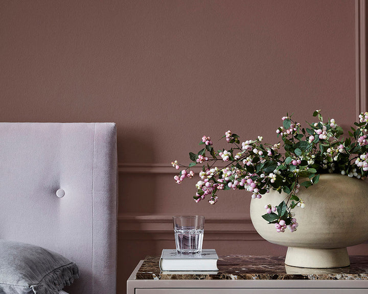 Little Greene Nether Red 315 Paint on a bedroom wall with French Grey woodwork