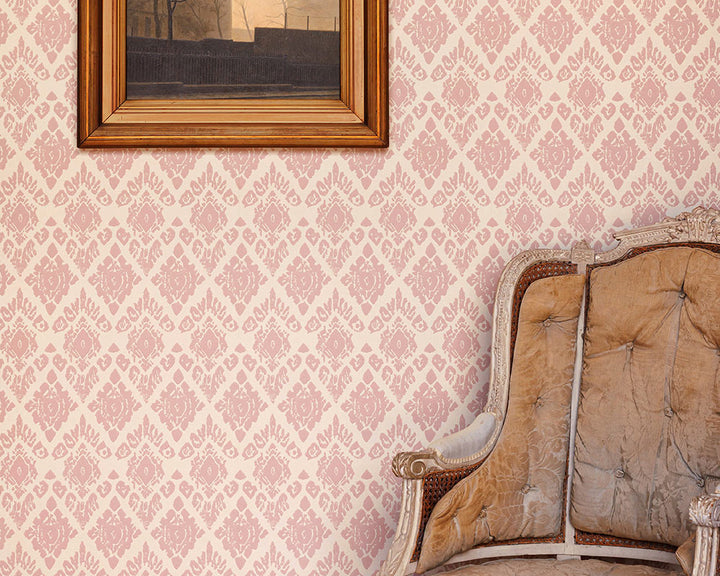 Barneby Gates Ikat Wallpaper in a room with a chair and a frame on the wall