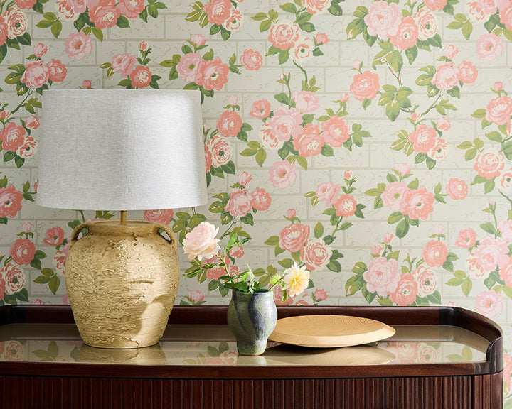 Little Greene Rose Garden Floral wallpaper with a lamp and decorative items on a table