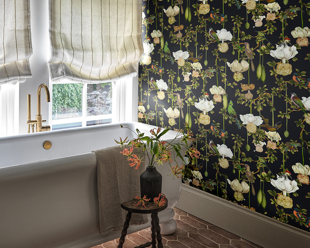 Bathroom with floral Cole & Son Baobab Botanica Wallpaper, bathtub, and window with curtains.