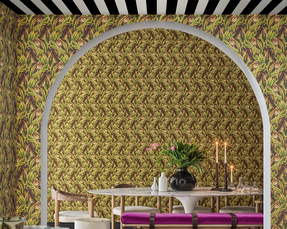 Dining room with a patterned Cole & Son Cheetah Prowl Wallpaper and table setting