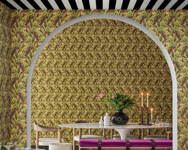 Dining room with a patterned Cole & Son Cheetah Prowl Wallpaper and table setting
