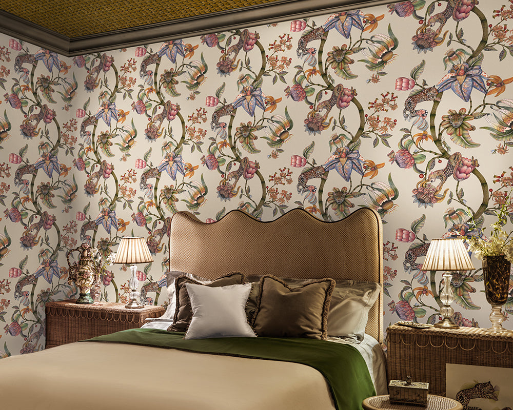 Decorative bedroom with floral Cole & Son Protea Panthera Wallpaper, bed, and lamps.