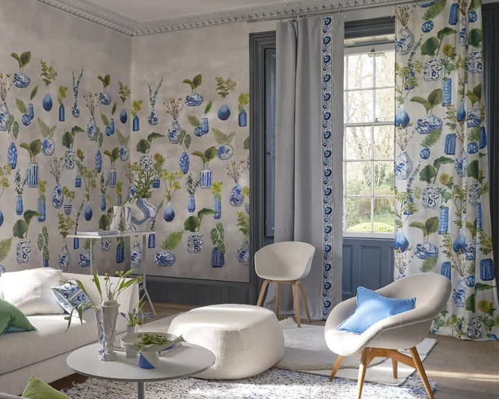 Living room with floral wallpaper, Designers Guild Kawana Wallpaper, curtains, and modern furniture.
