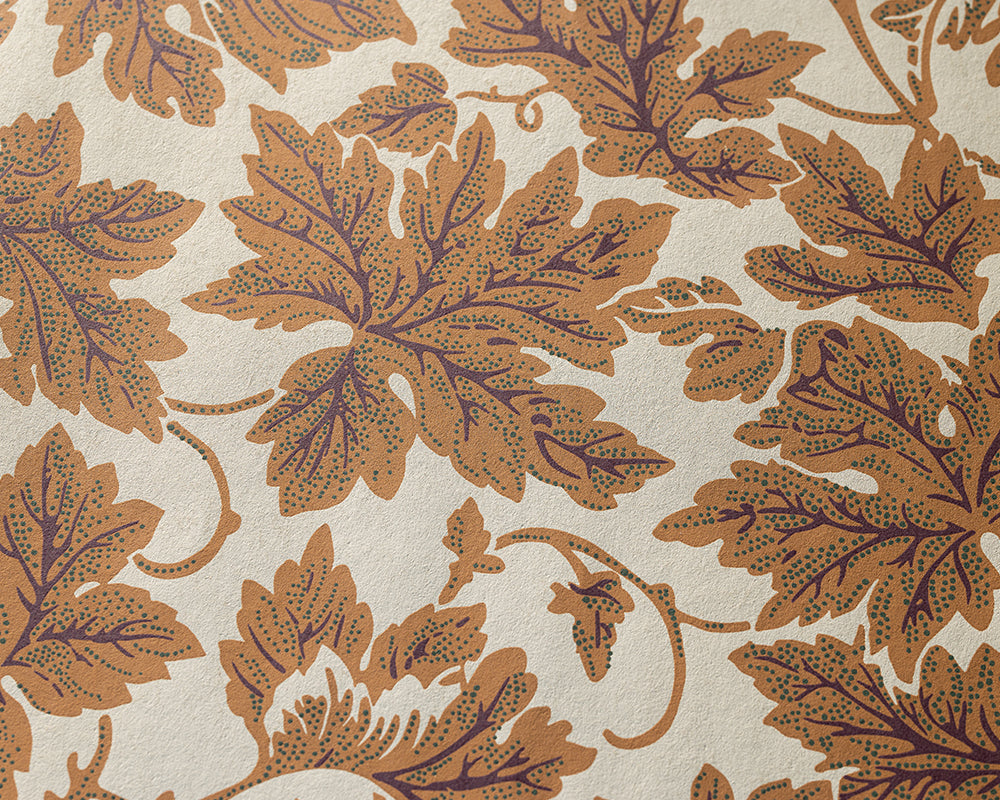 Farrow and Ball Vine Leaf - A close-up of a repeating botanical pattern featuring large tan and brown leaves with dotted detailing on a warm off-white background.