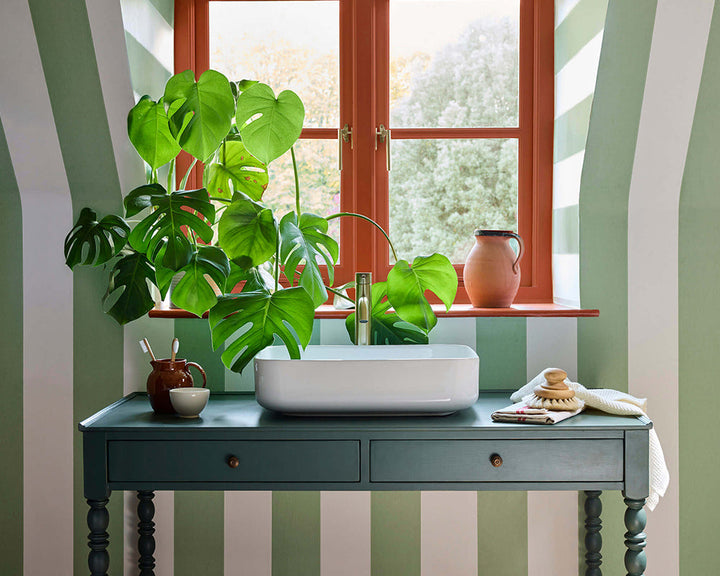 Little Greene Broad Stripe Wallpaper in Pea in an office space