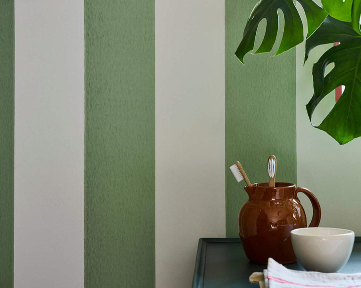 Little Greene Broad Stripe Wallpaper in Pea in an office space close up