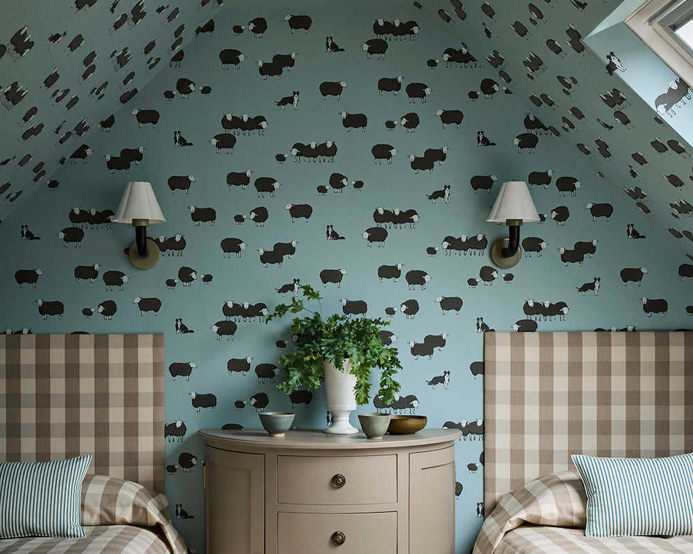 Little Greene Nip & Lassie Wallpaper in Celestial Blue in a bedroom