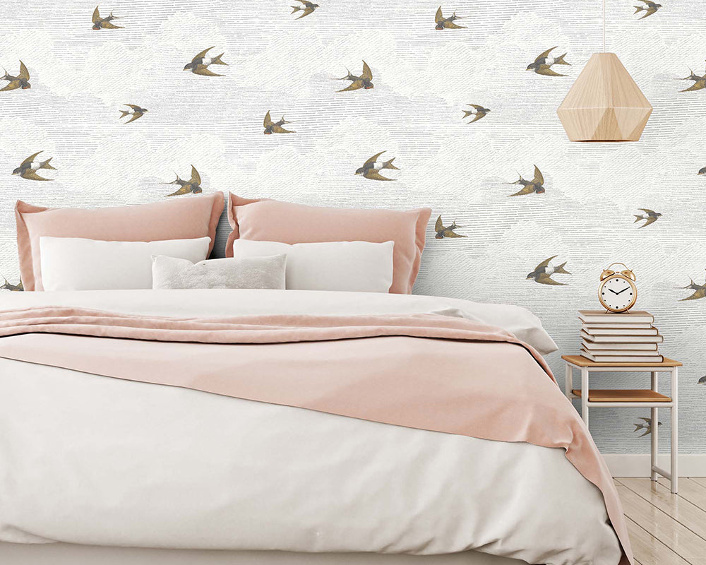 Woodchip & Magnolia Sweeping Swallows Wallpaper in a bedroom