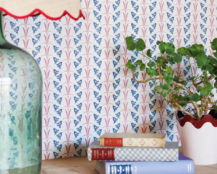 Barneby Gates Bluebells Wallpaper in Blue / Raspberry in a desk set up detail
