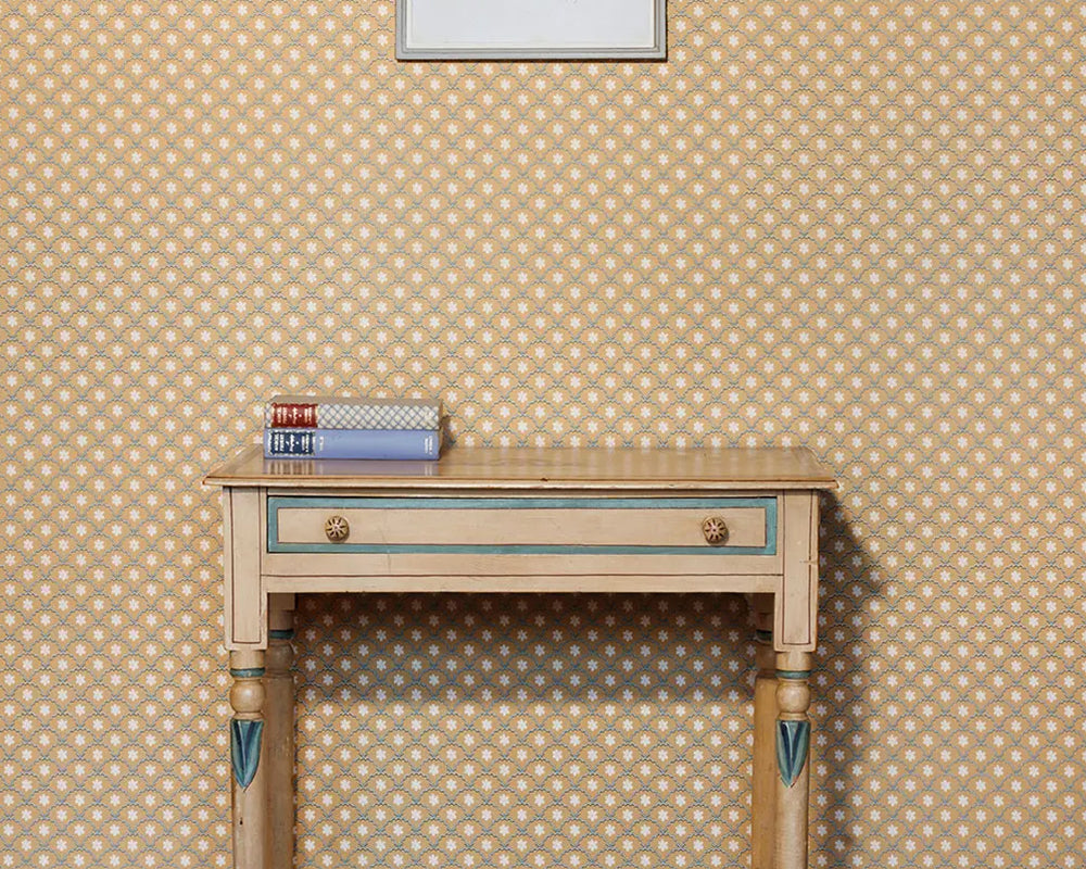 Barneby Gates Daisy Scallops Wallpaper in Sand/Ink with a desk