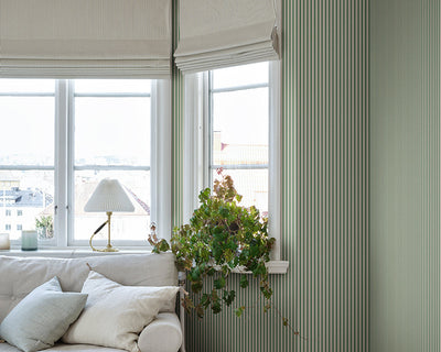 Sandberg Linn Wallpaper in Green in a living room