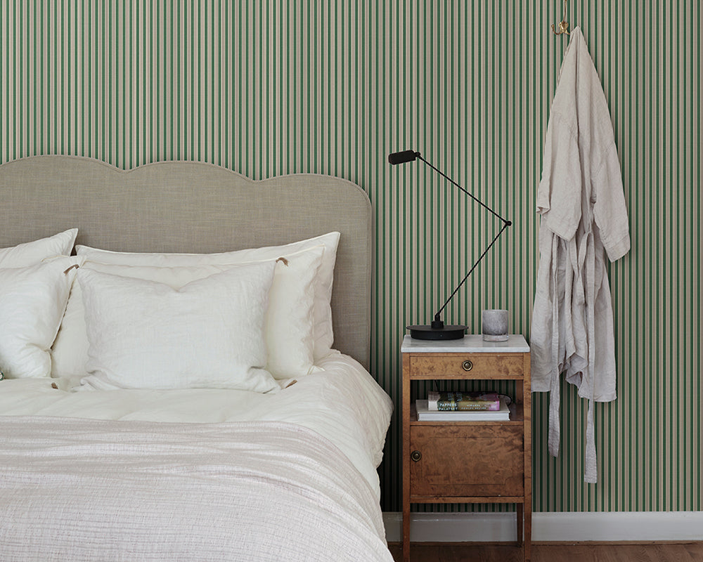 Sandberg Linn Wallpaper in Green in a bedroom
