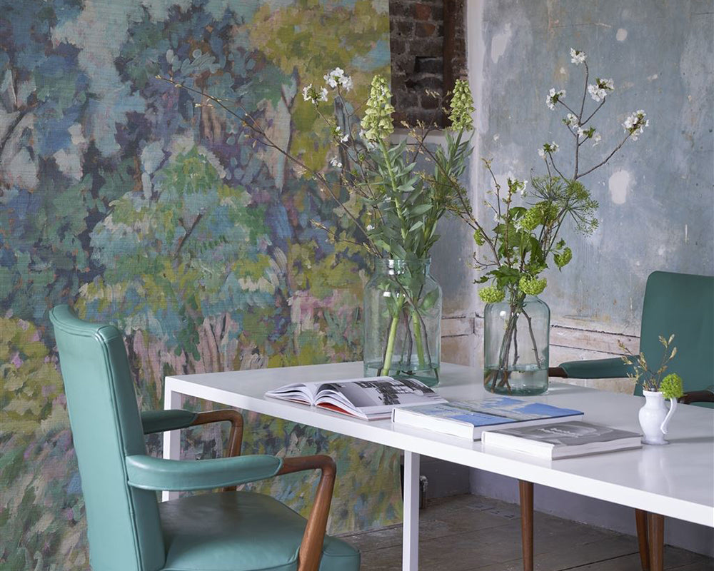 Designers Guild Foret Impressionniste Grasscloth Wallpaper in a room with a table