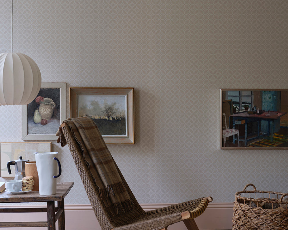 Farrow and Ball Achard Wallpaper 6402 in a living space with woven chair