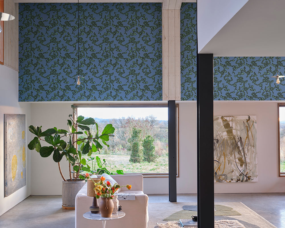 Farrow and Ball Adelaide Wallpaper 6304 above a window in a large open plan space