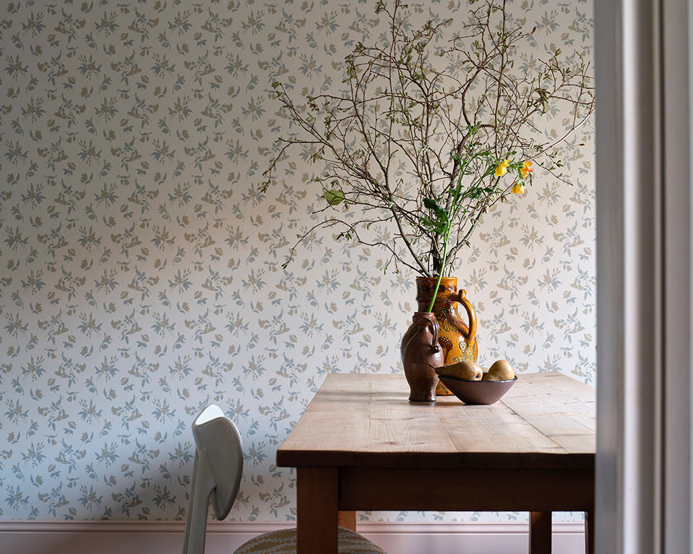 Farrow and Ball Auguste Wallpaper 6501 in a living space with vase and foliage