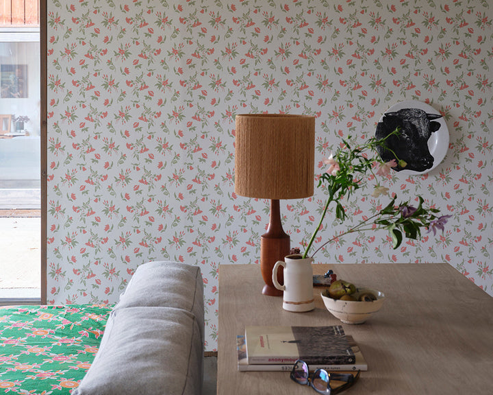 Farrow and Ball Auguste Wallpaper 6503 in a bedroom with table and lamp