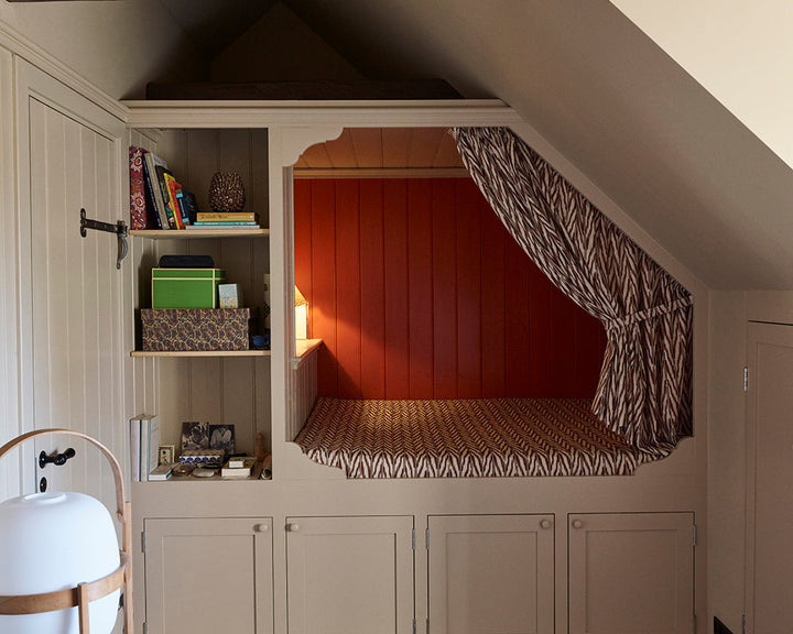 Oxford Stone 264 paint by Farrow & Ball in a bedroom with a bed built into the alcove