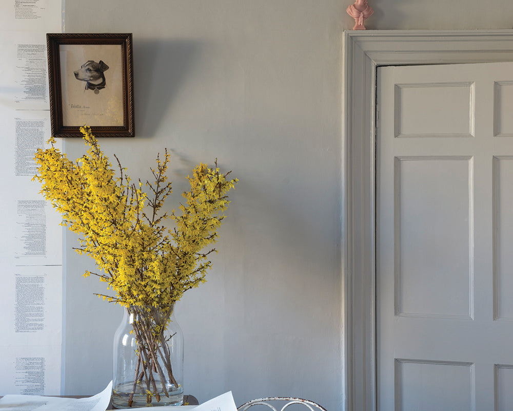 Purbeck Stone 275 paint by Farrow & Ball in a room with a vase