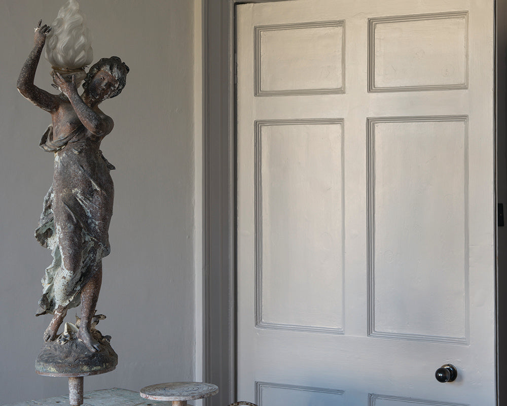 Purbeck Stone 275 paint by Farrow & Ball in a traditional home with a statue