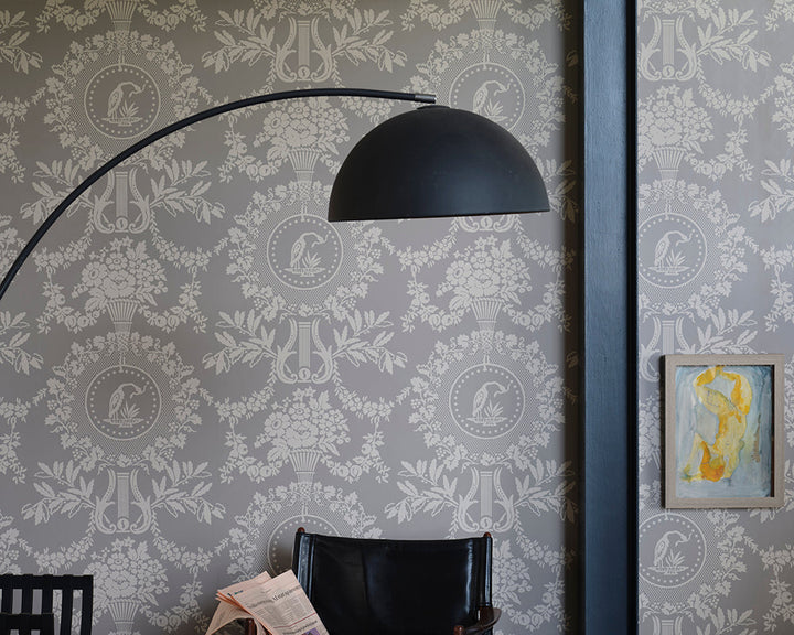 Farrow and Ball Purnon 6202 Wallpaper with black furnishings in a living room